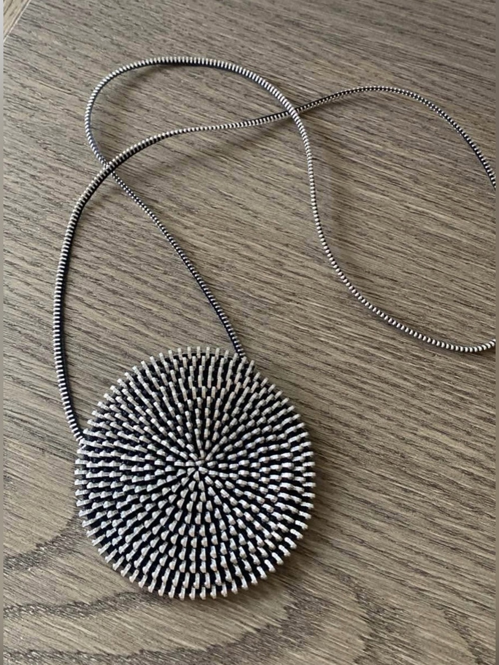 zipper necklace designed by Argentinian artist Doris
Vinas